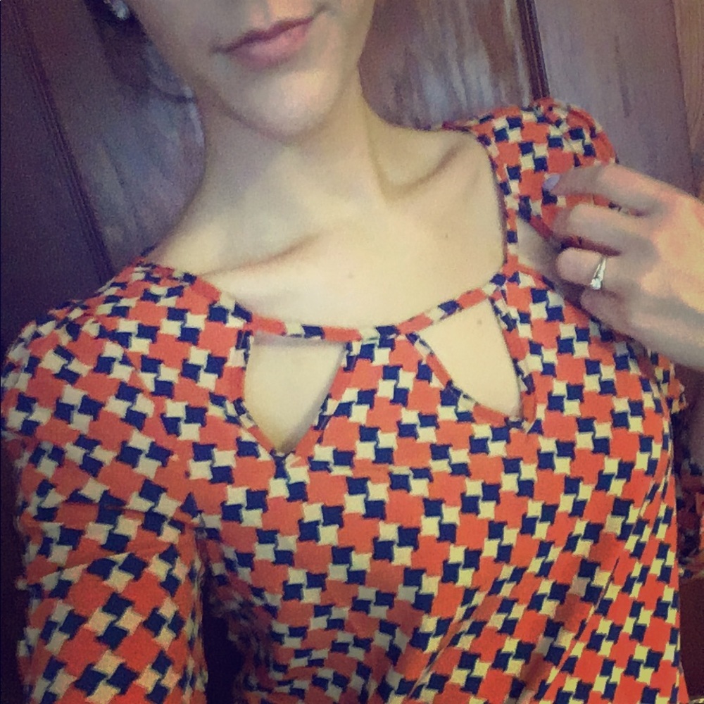 Blue and burnt orange blouse.